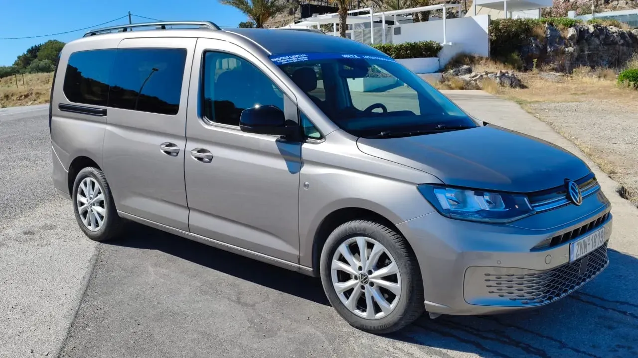 Grey Volkswagen Caddy family transfer van in Rhodes